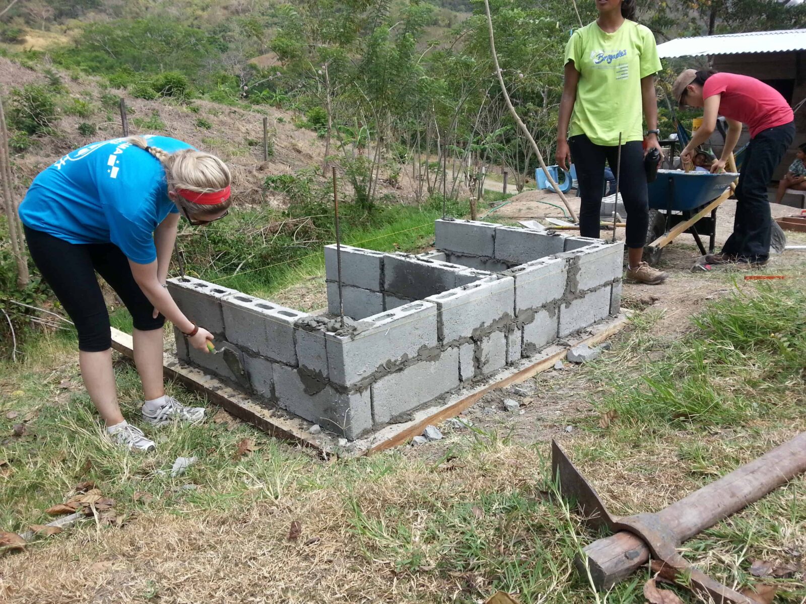 Volunteers contributing to a household project